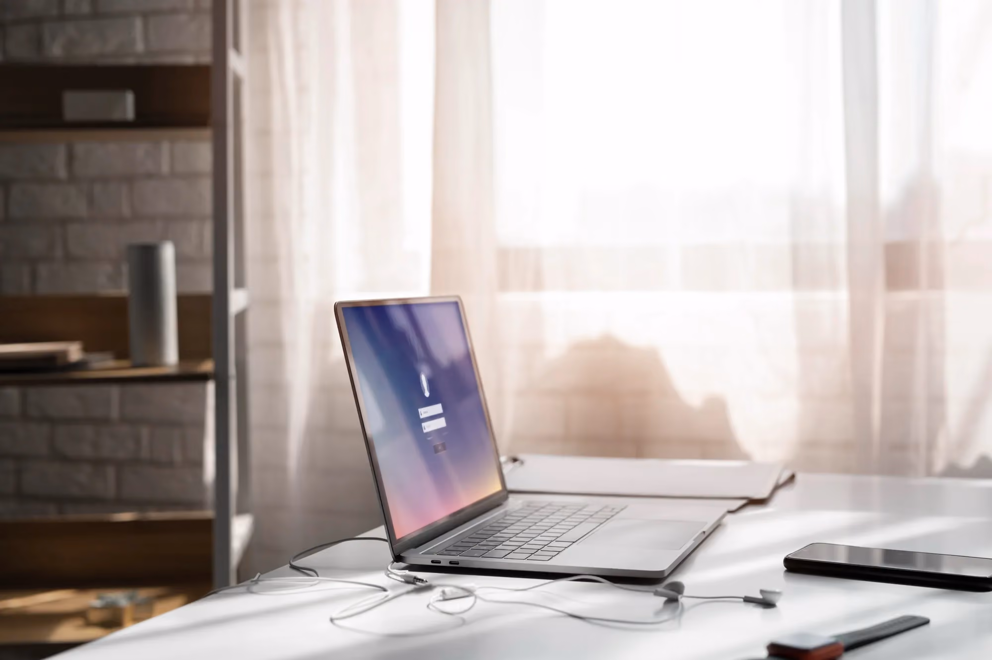 Laptop and phone on a home office desk