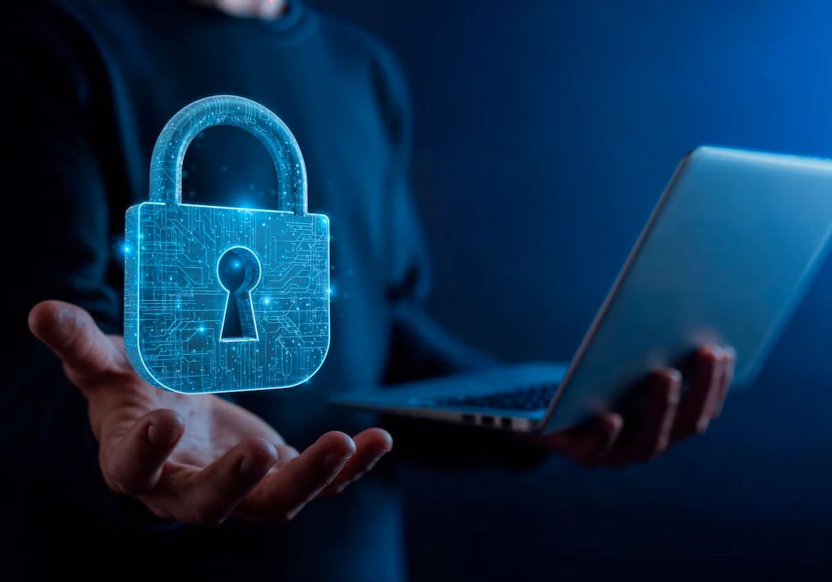 Digital padlock above a laptop representing password security